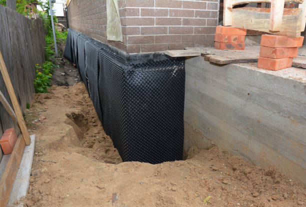 Happy homeowners after waterproofing job in New Washington